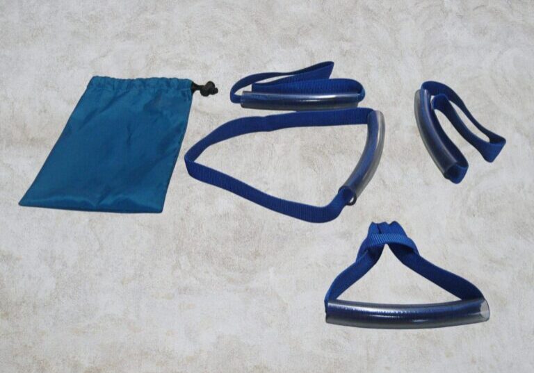 four blue webbing handles on a table next to a blue storage bag